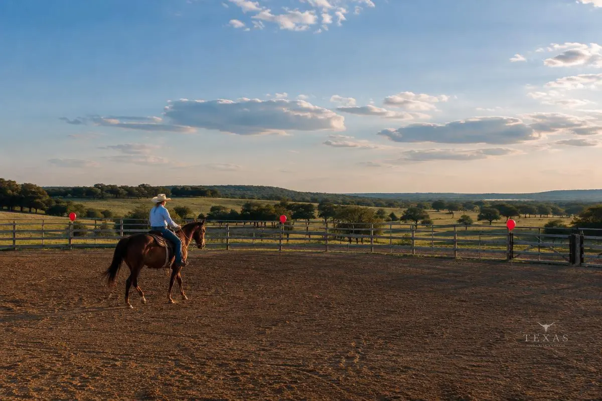 Western arena and Texas landscape